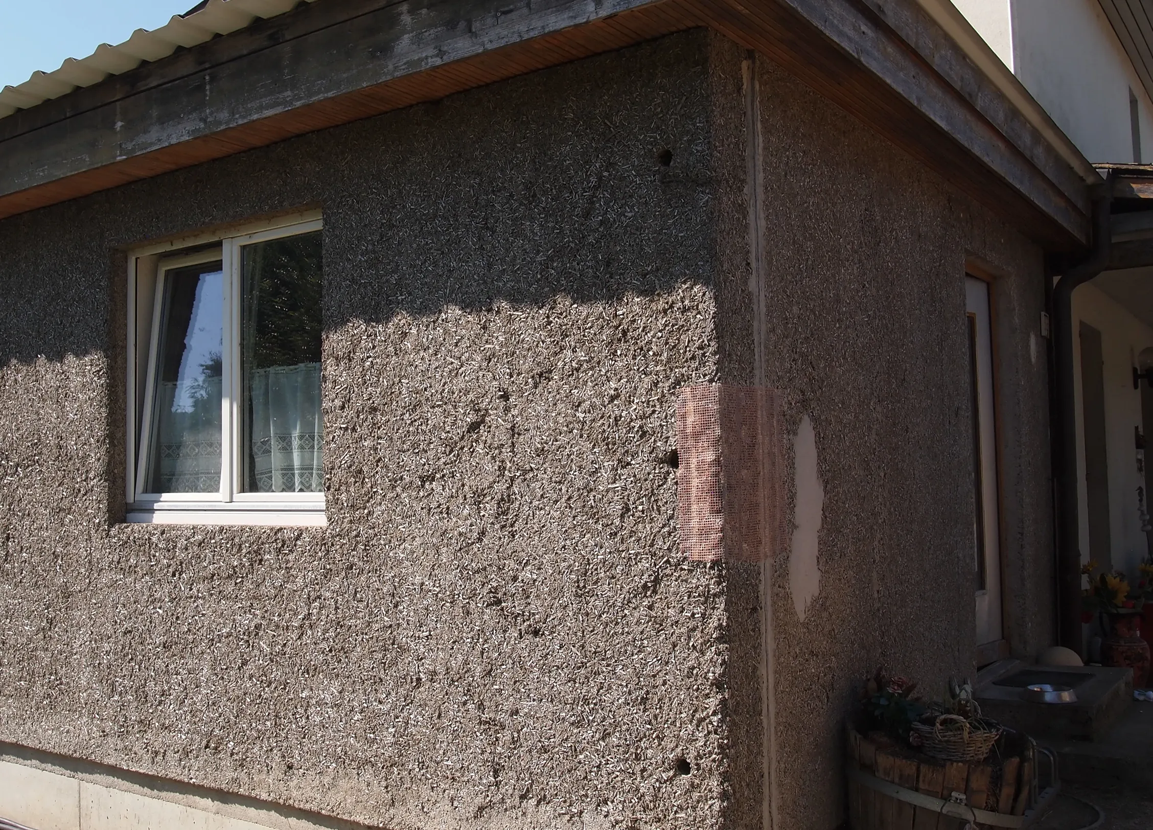 Pilotanbau an ein Wohnhaus